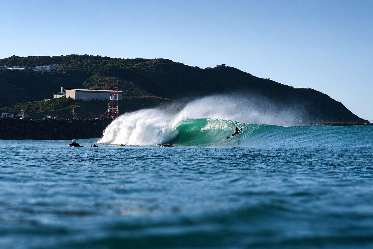 Surfer riding a barrel at Lyall Bay beach Wellington